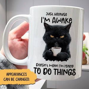 Funny personalized mug featuring a grumpy black cat with a coffee cup and humorous text