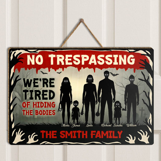 Halloween Wooden Door Sign with spooky family silhouette and humorous trespassing message