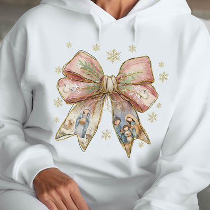 White hoodie with a Jesus Christmas bow shirt design featuring a pink bow and nativity scene details