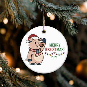 Merry Resistmas 2025 ceramic ornament featuring a festive pig character in a Santa hat