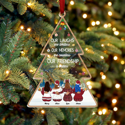 Personalized best friends ornament shaped like a Christmas tree with names and friendship quote hanging on a tree
