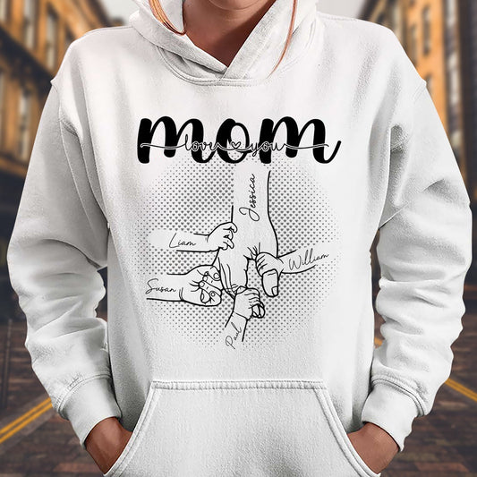 White hoodie featuring mom and hand holding design with names and the phrase a mother's love is forever shirt