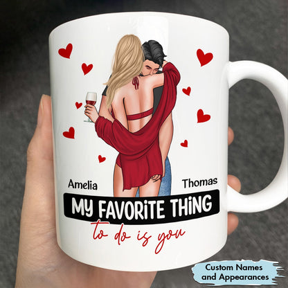 My favorite thing to do is you mug featuring a couple hugging with custom names Amelia and Thomas and red hearts