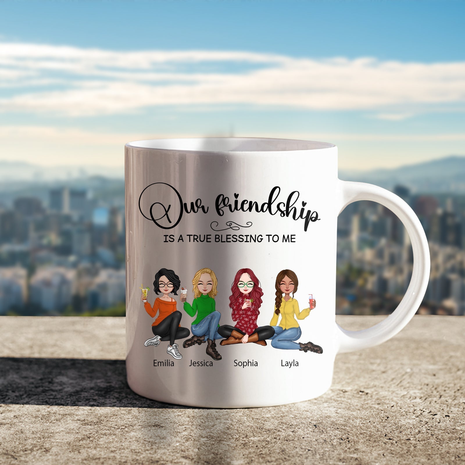 White ceramic our friendship is a true blessing mug featuring four illustrated women with names Emilia Jessica Sophia and Layla