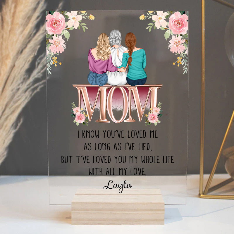 Personalized acrylic mom plaque featuring three women sitting with the word MOM in floral design