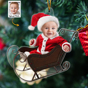 Personalized baby photo ornament featuring a baby in Santa suit sitting in a sleigh Christmas decoration