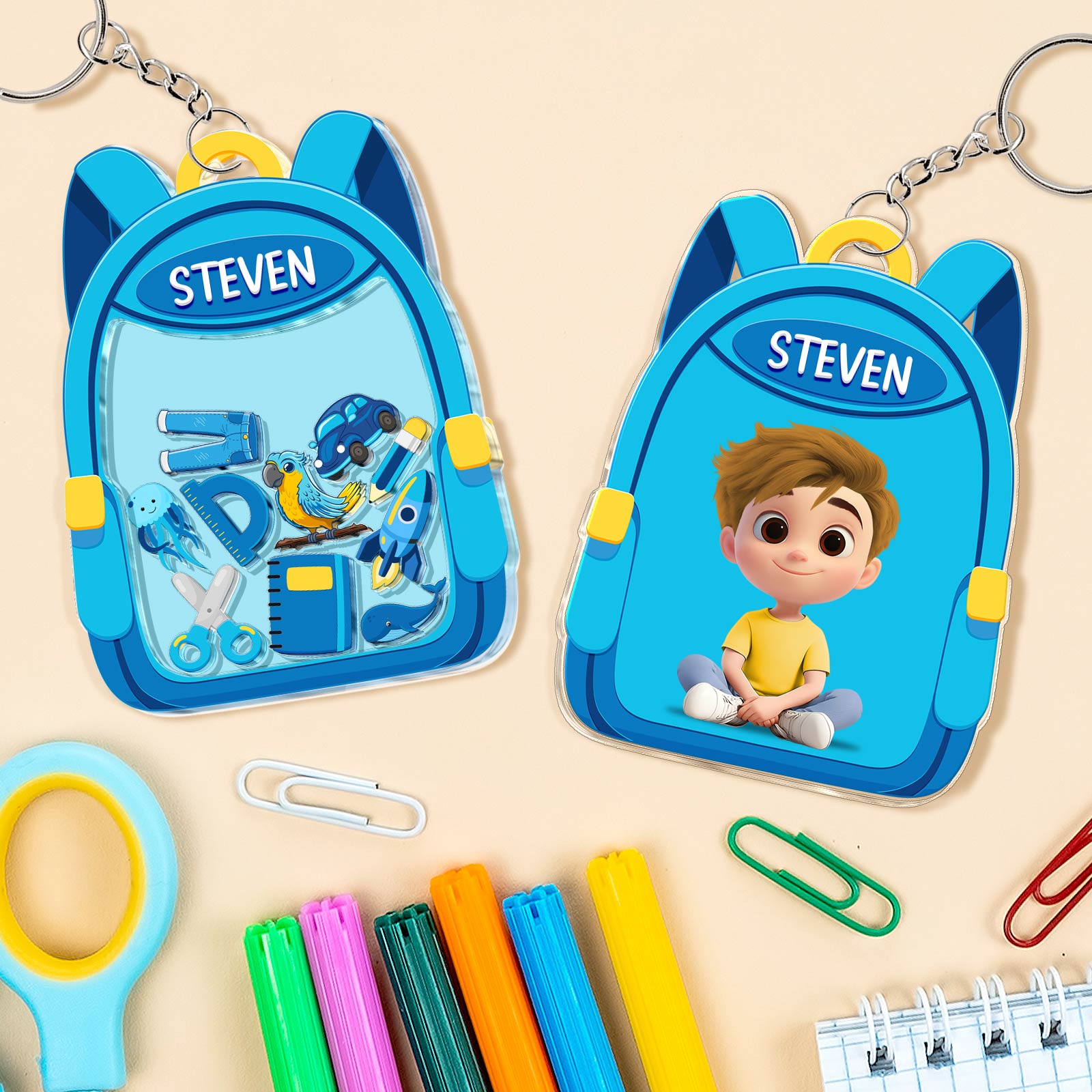Personalized back to school keychain in a blue backpack design with the name Steven