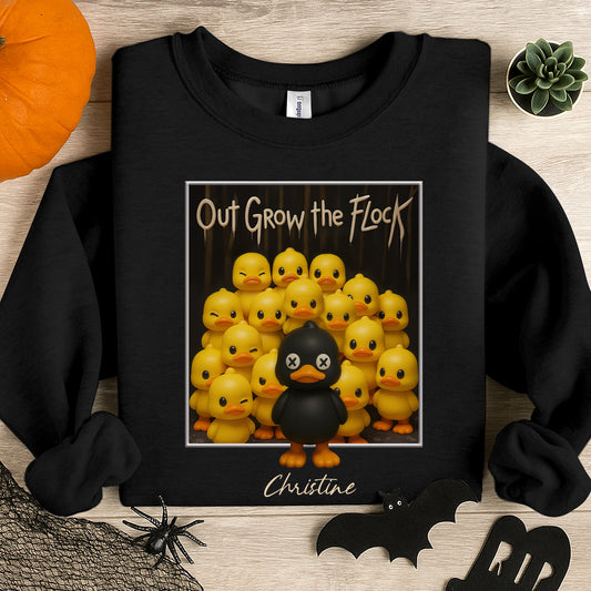 Personalized black duck shirt with black duck standing out among yellow ducks and text Out Grow the Flock