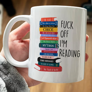 Personalized book lover mug featuring colorful stack of books with humorous quote for avid readers