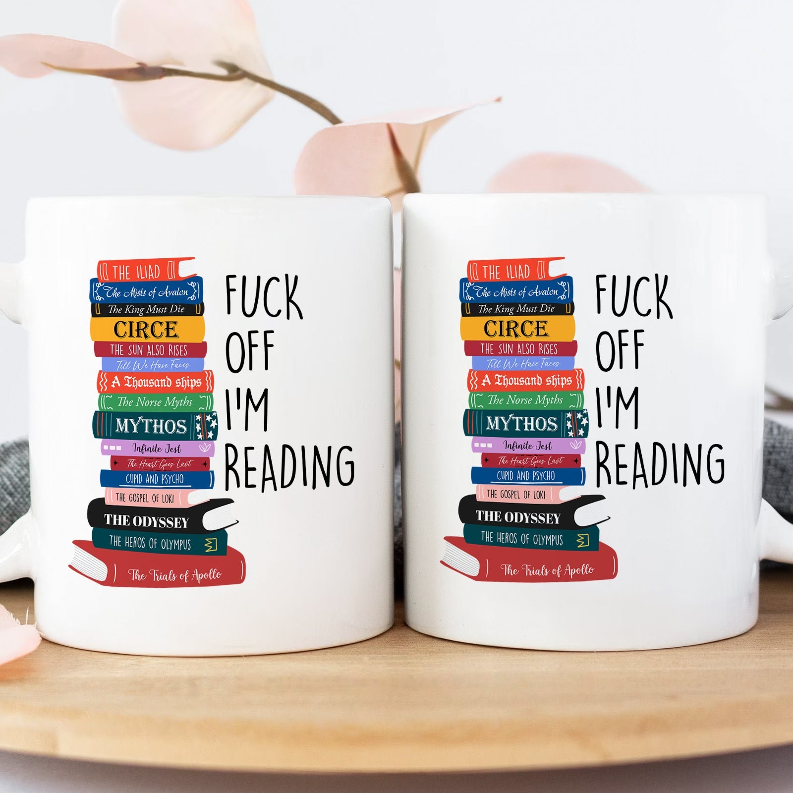 Personalized book lover mug with colorful stacked books and playful reading quote