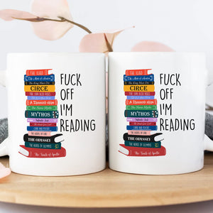 Personalized book lover mug with colorful stacked books and playful reading quote
