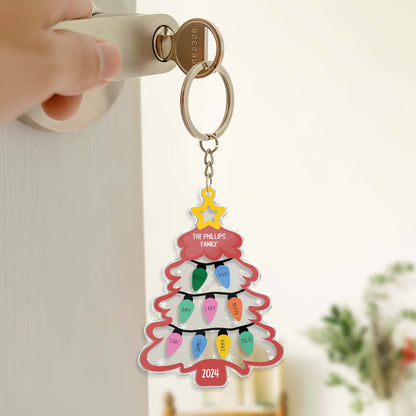 Personalized Christmas keychain shaped like a decorated tree with colorful lights and custom family names
