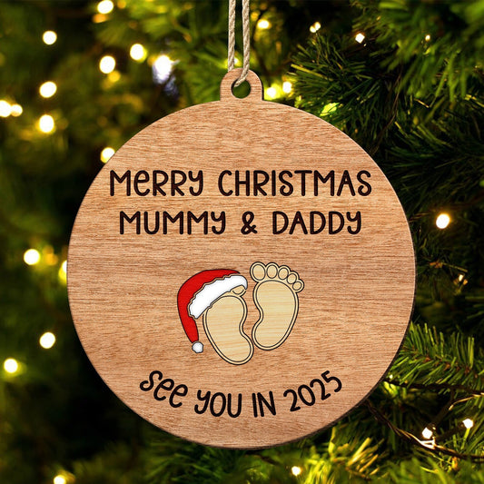 Personalized Christmas ornament for parents with baby footprints and Merry Christmas message hanging on tree