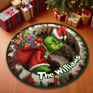 Personalized Christmas round mat featuring the Grinch holding gifts and customizable with family name