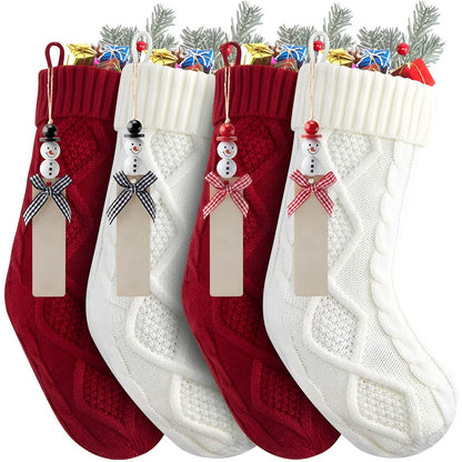 Set of red and white personalized Christmas stockings with snowman tags and assorted holiday gifts inside