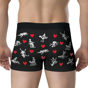 Black personalized couple boxers featuring playful skeleton designs and heart patterns for fun gifts