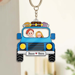 Personalized couple keychain featuring a car with two cartoon figures and custom names James and Susan