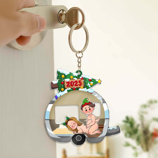 Personalized couple keychain featuring cartoon couple in a festive camper dated 2025