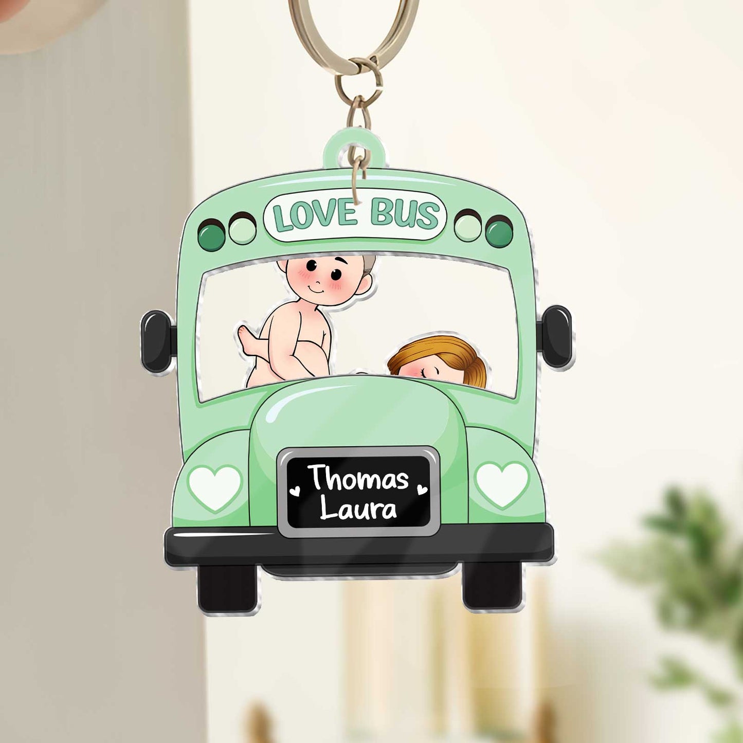 Personalized couple keychain featuring a cute Love Bus design with names Thomas and Laura