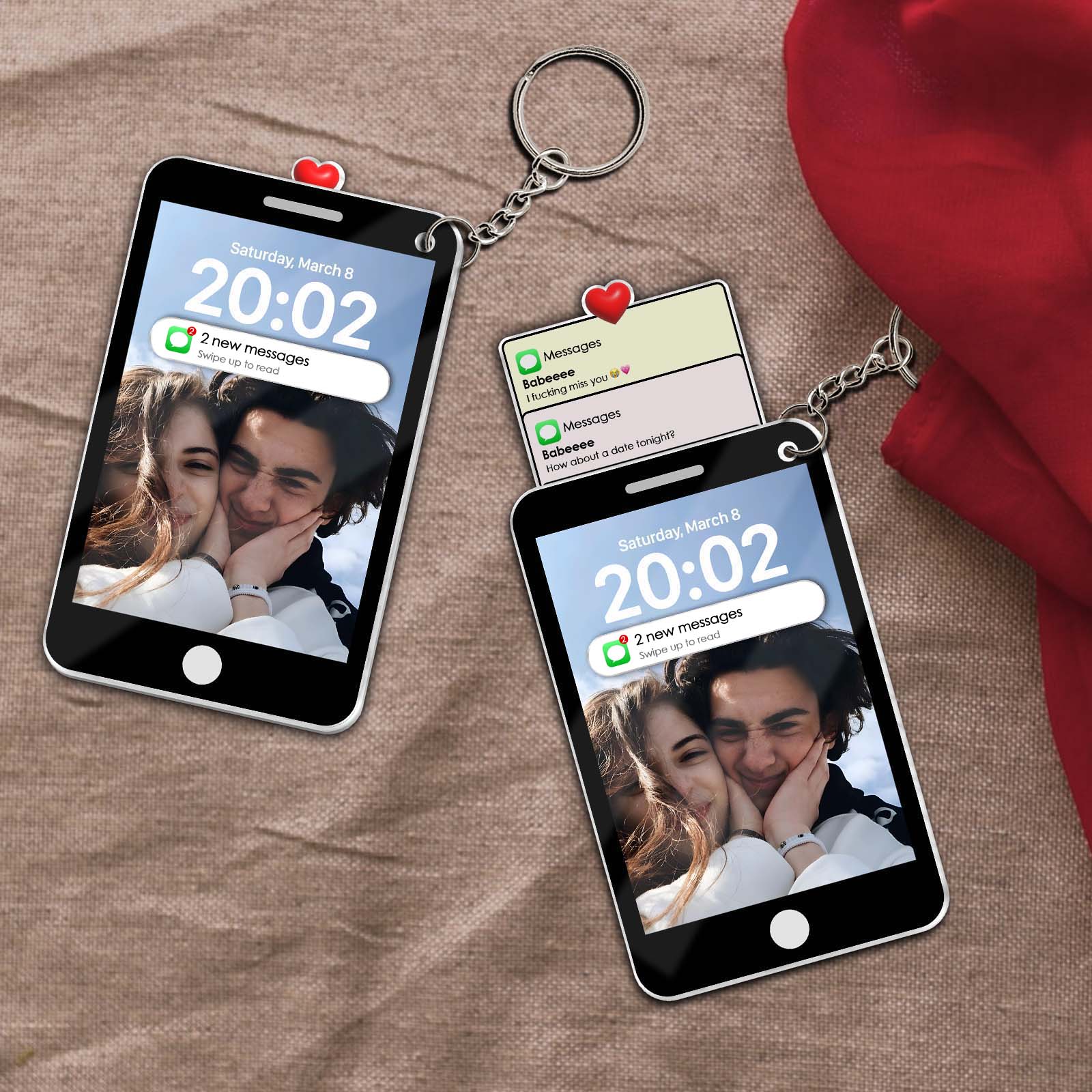 Personalized couple keychain featuring mini phone designs displaying affectionate messages