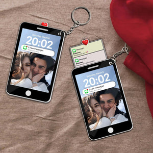 Personalized couple keychain featuring mini phone designs displaying affectionate messages