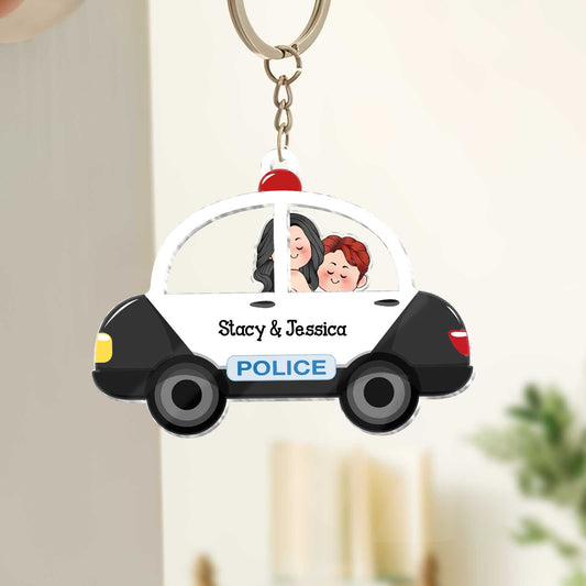 Personalized couple keychain featuring cartoon characters in a police car design