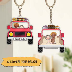 Personalized couple keychain with custom characters in a red truck, perfect for gifts