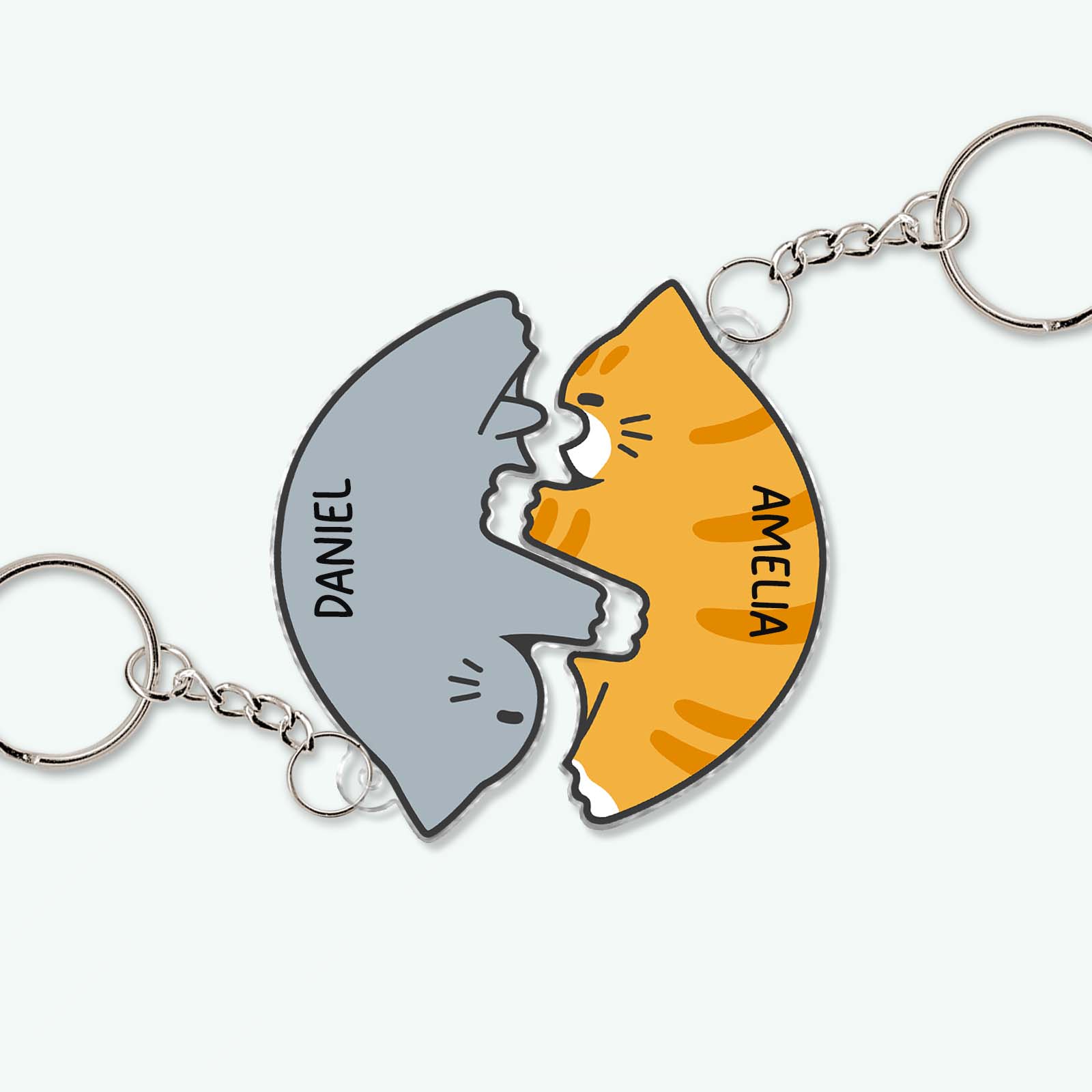 Personalized couple keychain set featuring matching gray shark and orange cat with names Daniel and Amelia
