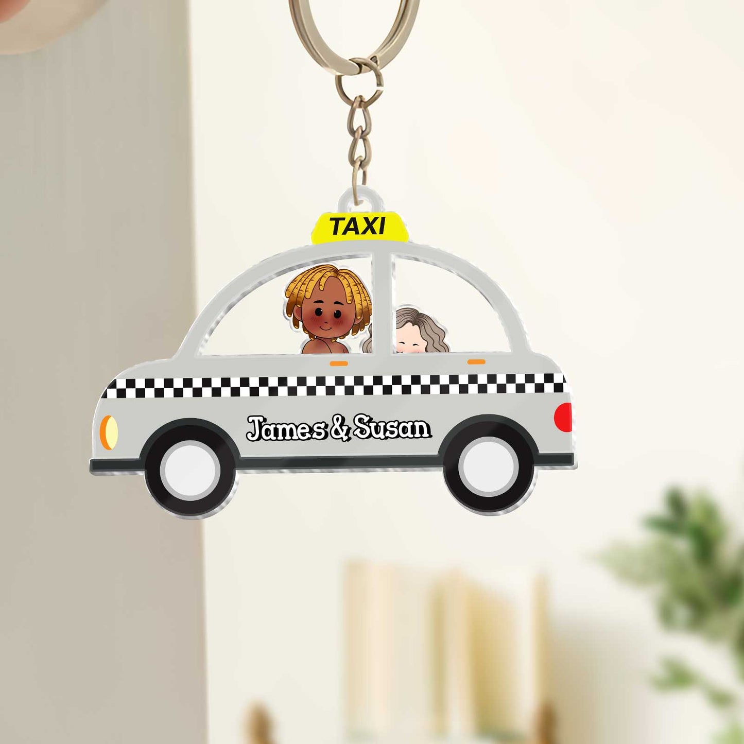Personalized couple keychain featuring a taxi design with James and Susan for couples