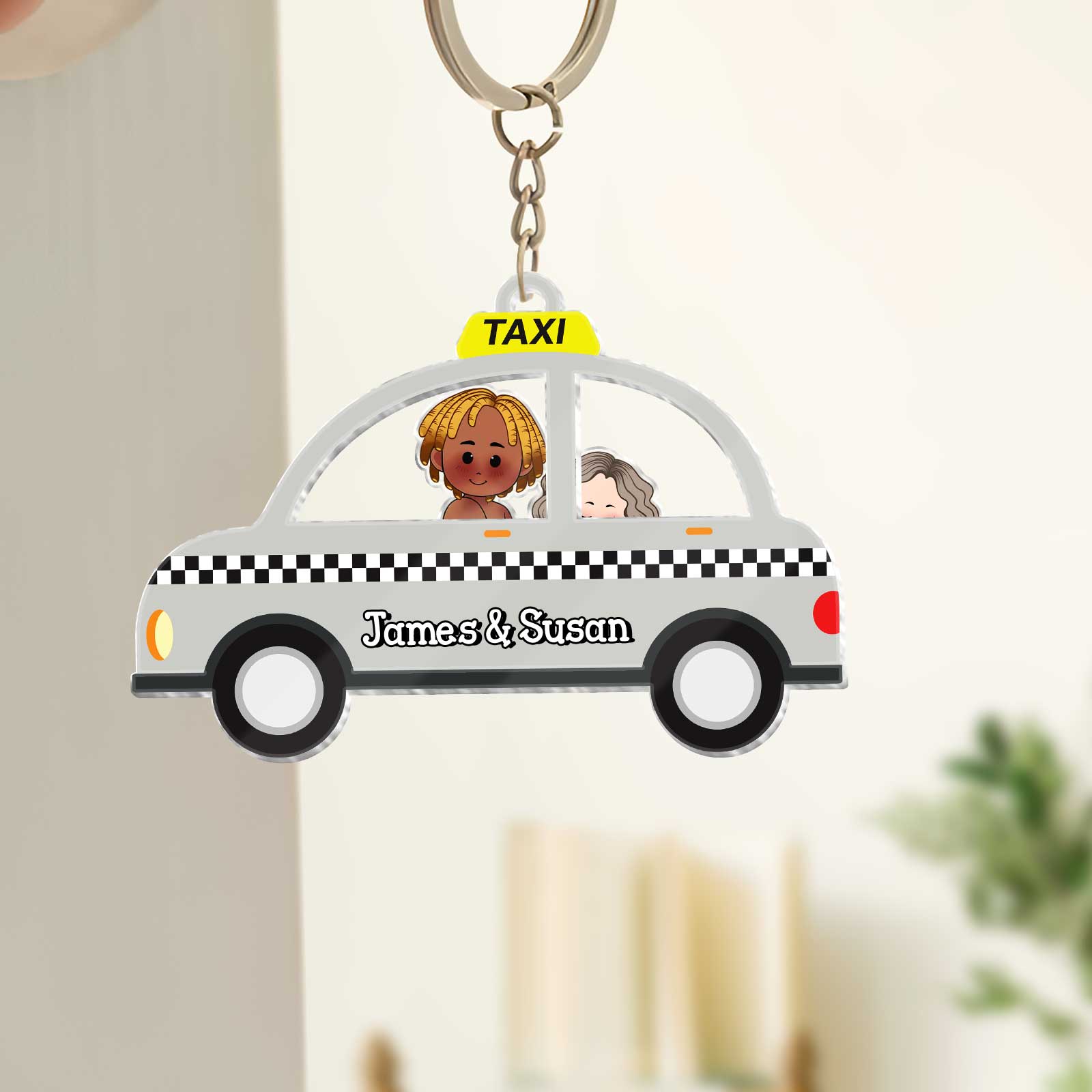 Personalized couple keychain featuring a taxi design with James and Susan for couples