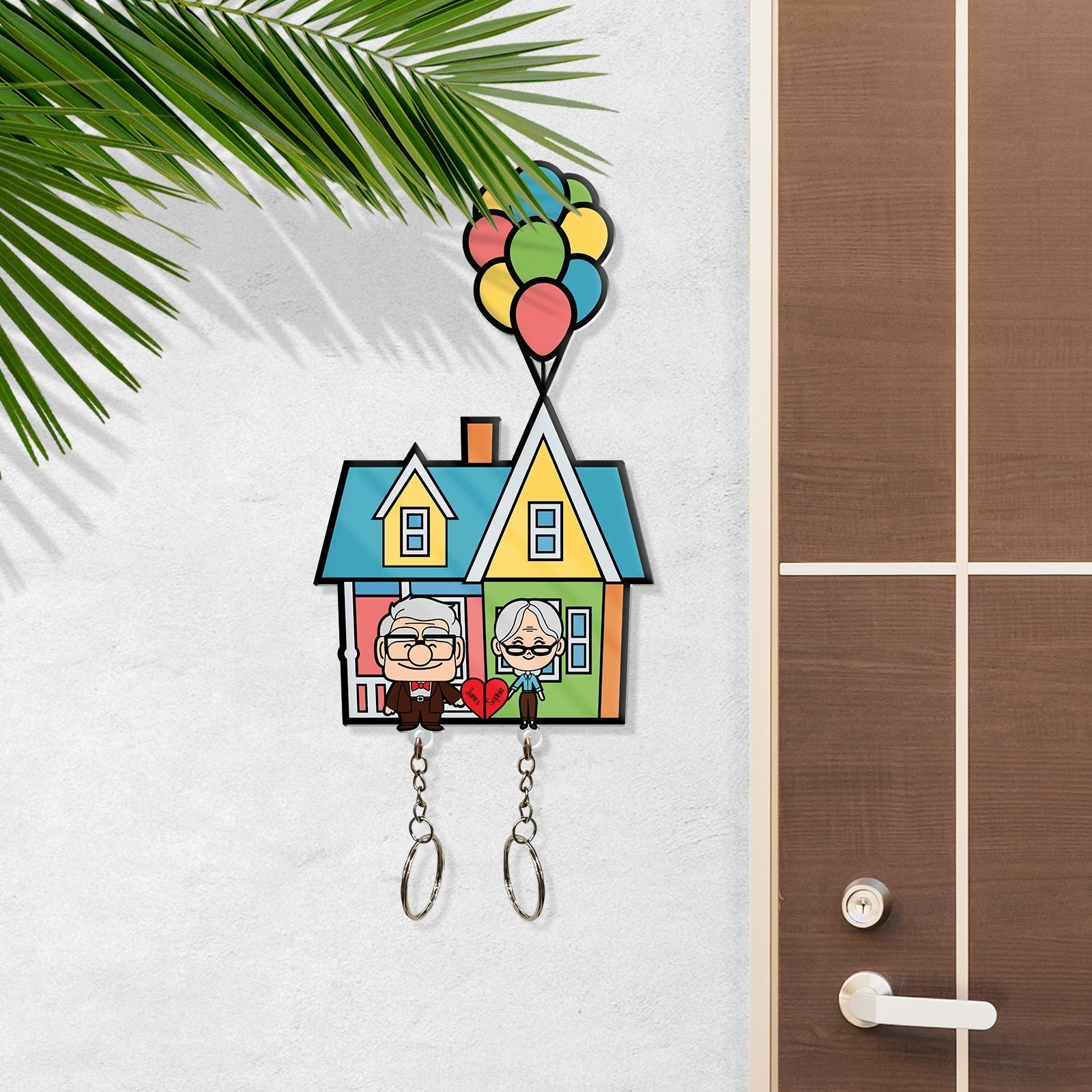 365Gifty personalized couple keychain featuring a colorful house with cartoon elderly couple and balloons