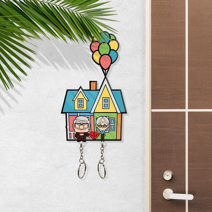 365Gifty personalized couple keychain featuring a colorful house with cartoon elderly couple and balloons