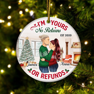 Personalized couple ornament with I'm Yours No Returns or Refunds text featuring a couple hugging by Christmas tree