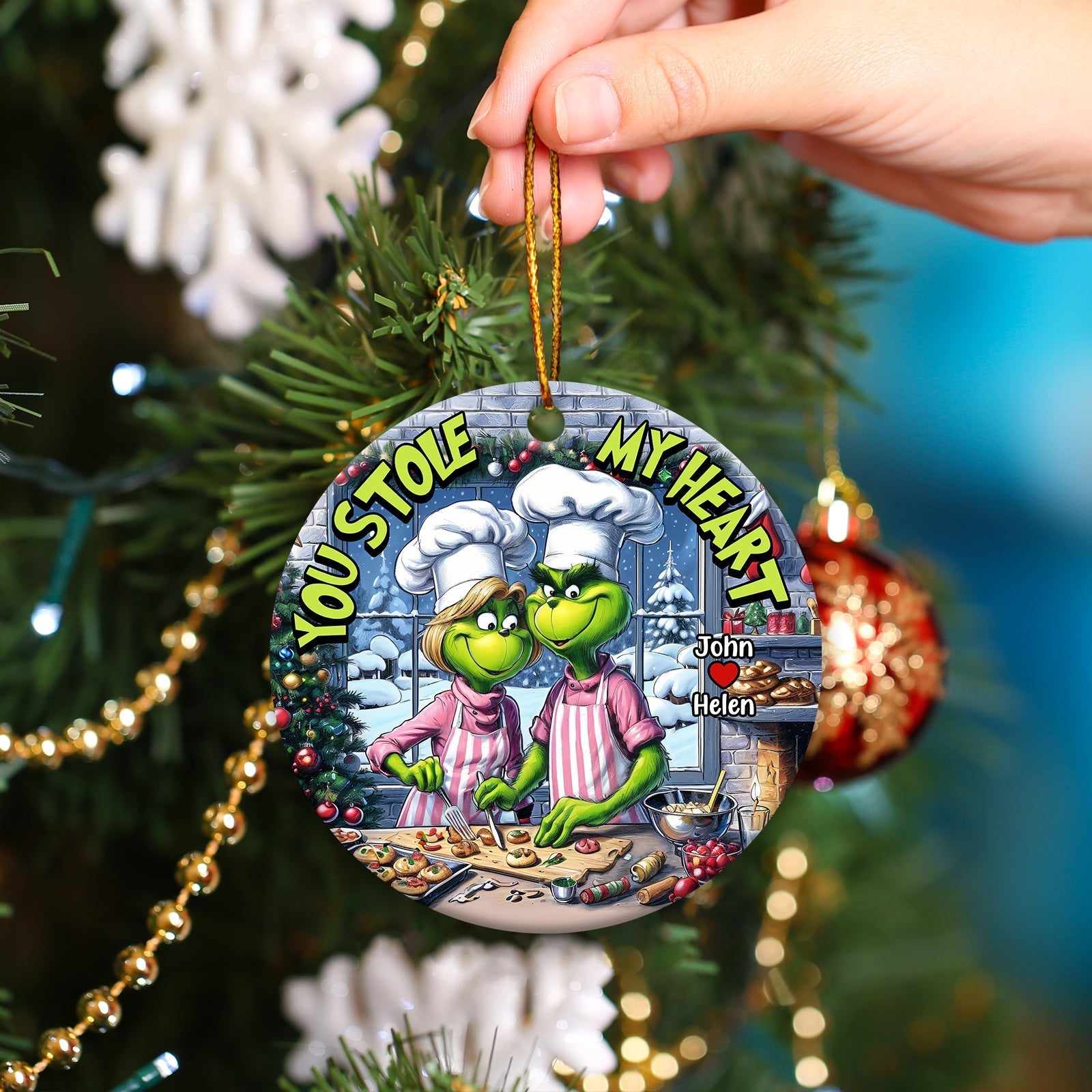 Personalized couple ornament with Grinch characters baking and text You Stole My Heart hanging on Christmas tree