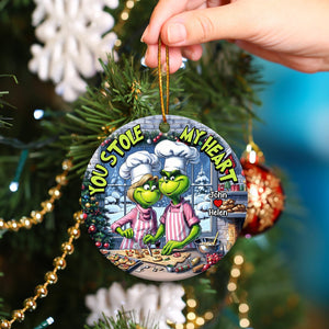 Personalized couple ornament with Grinch characters baking and text You Stole My Heart hanging on Christmas tree