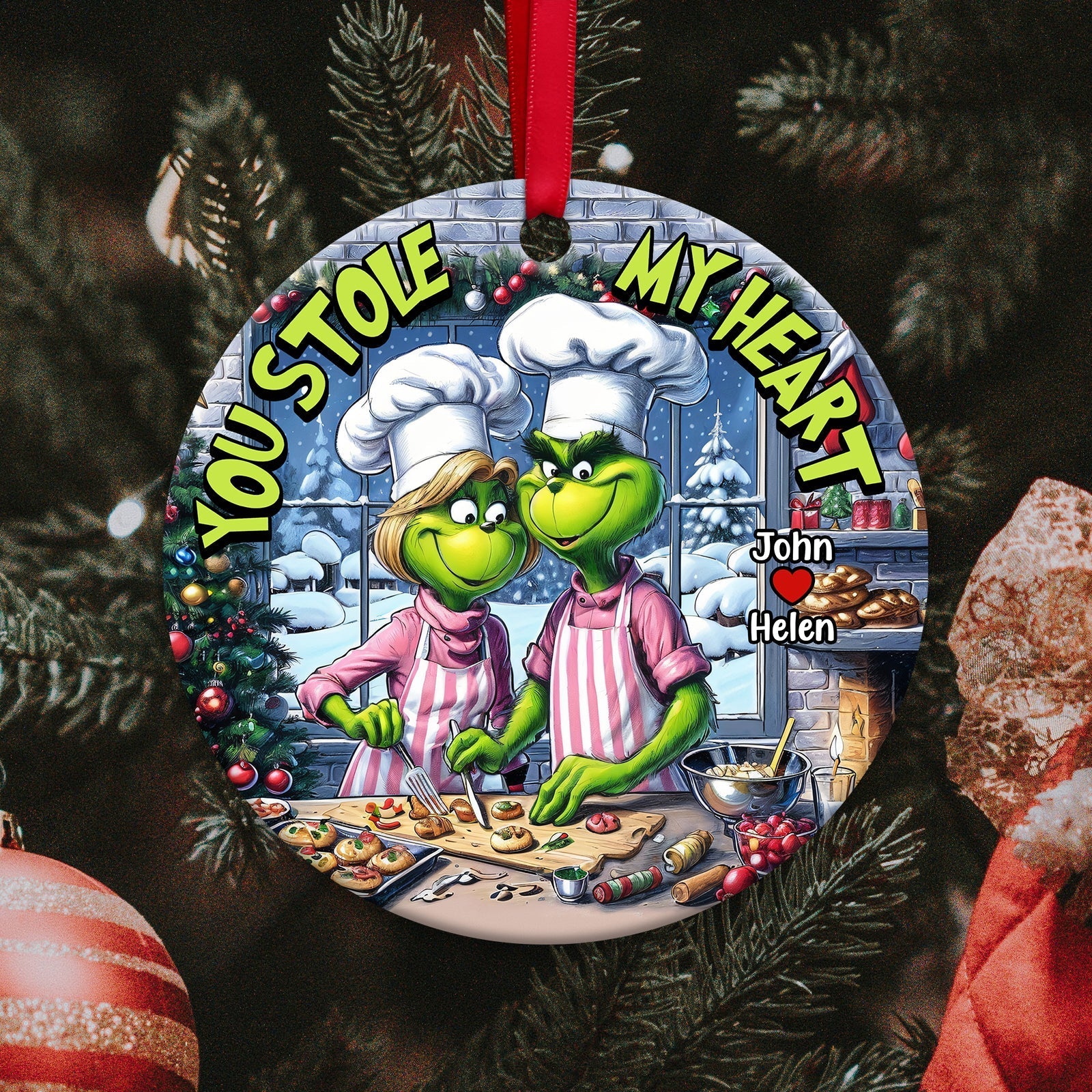 Personalized couple ornament featuring two cartoon chefs with text You Stole My Heart hanging on Christmas tree