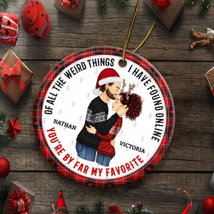Personalized couple ornament with a festive design featuring a couple hugging and names Nathan and Victoria