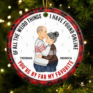 Personalized couple ornament with custom names Thomas and Monica featuring a loving couple hugging
