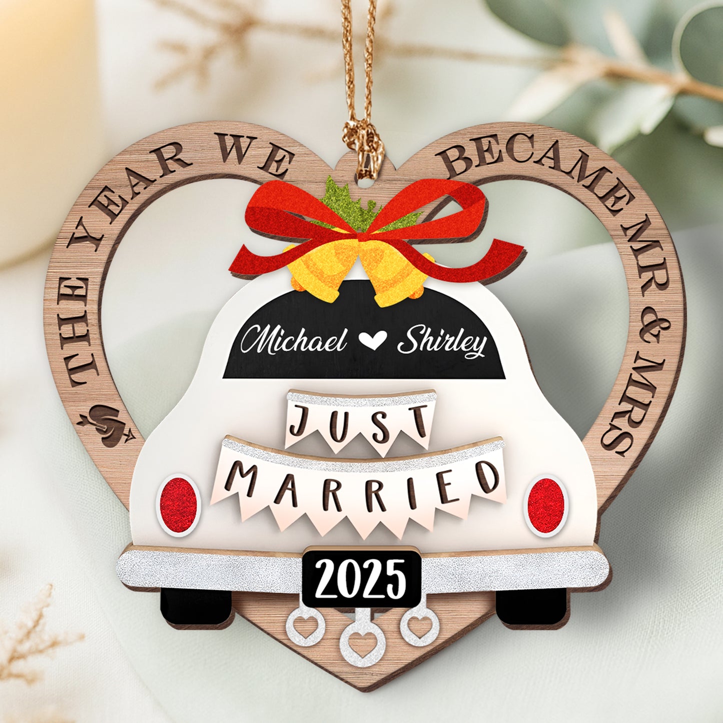 Personalized couple ornament featuring a wedding car design with names and year of marriage