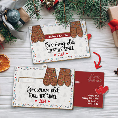 Personalized couples Christmas ornament with mitten design and custom names growing old together since 2014