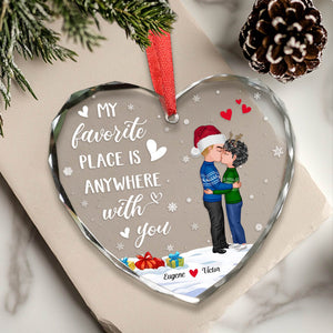 Personalized couples glass ornament featuring a heart design with names and festive graphics