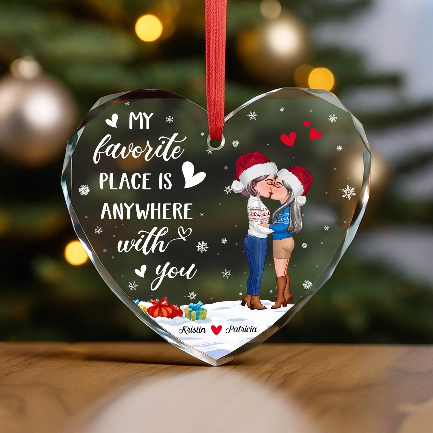 Personalized couples glass ornament featuring a heart design with a romantic couple and festive elements