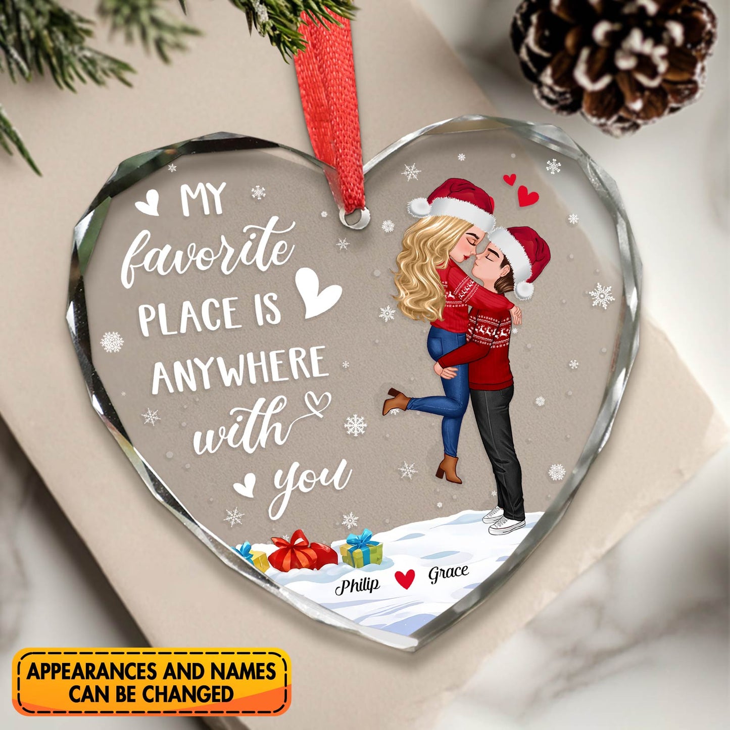 Personalized couples glass ornament featuring a heart shape and festive couple design celebrating love