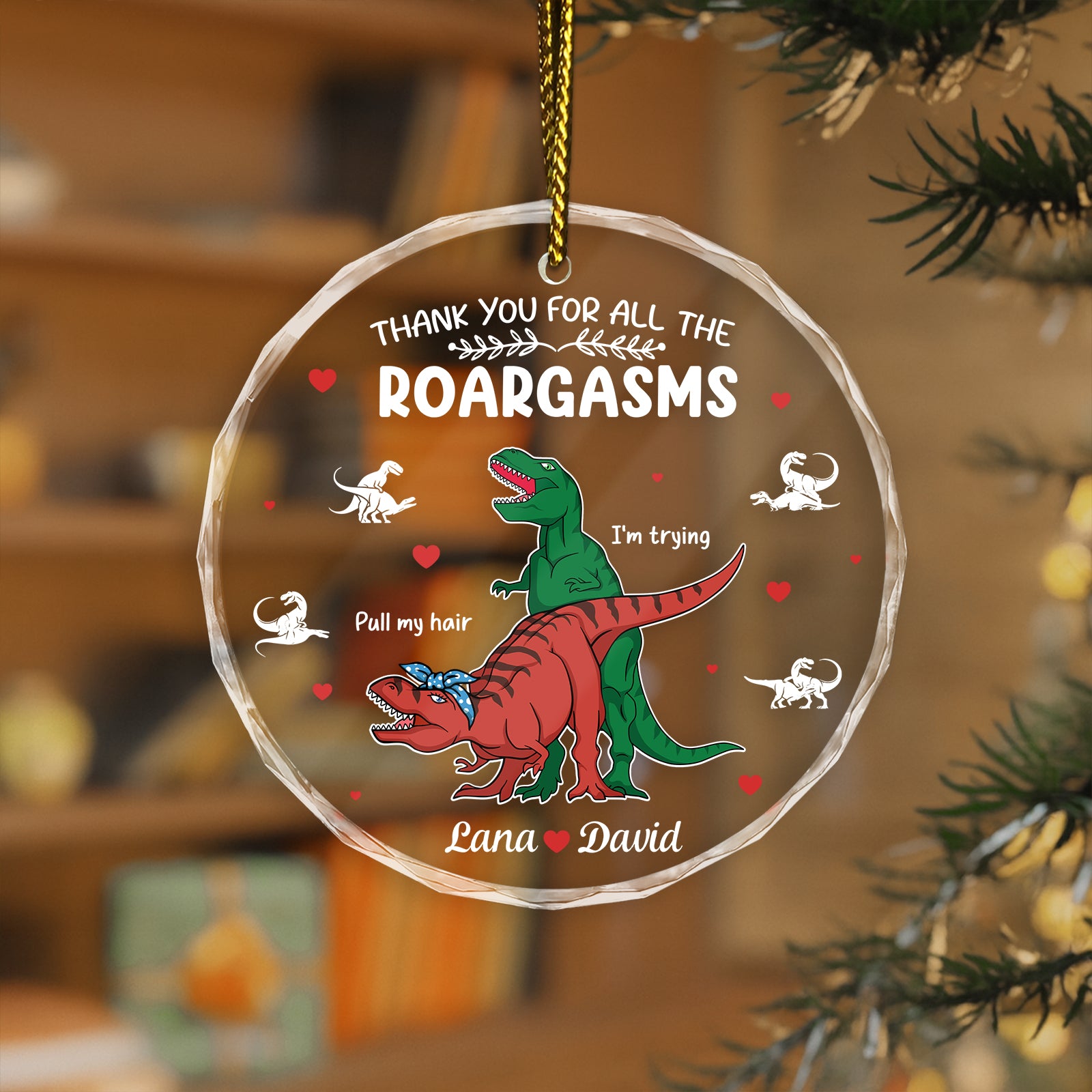 Personalized dinosaur glass ornament featuring colorful T-Rex and Velociraptor designs with heartfelt message