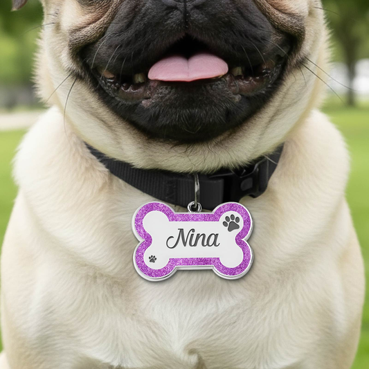 Personalized dog ID tag in pink and purple with the name Nina for pet identification