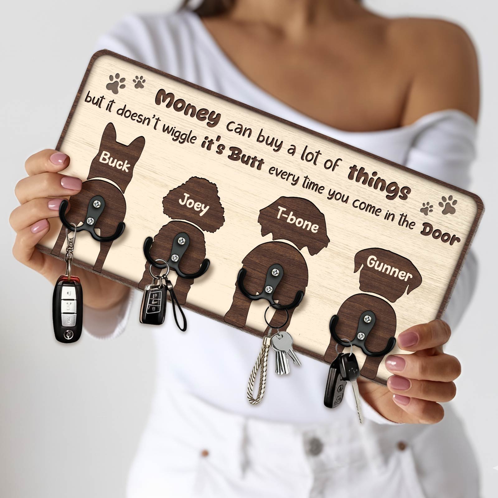 Personalized dog key holder featuring four dog silhouettes and humorous quote for pet lovers