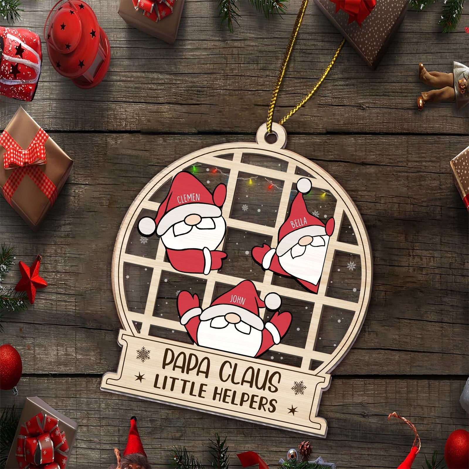 Personalized family Christmas ornament with Santa Claus faces and names Clemens Bella John on wooden background