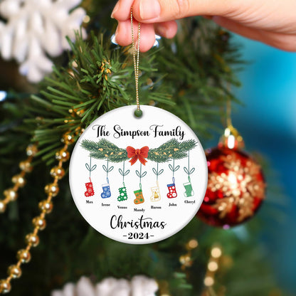 Personalized family Christmas ornament with names and stockings hanging on pine branch 2024