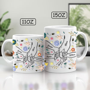 Personalized family mug featuring floral designs and names on a beautifully crafted ceramic mug