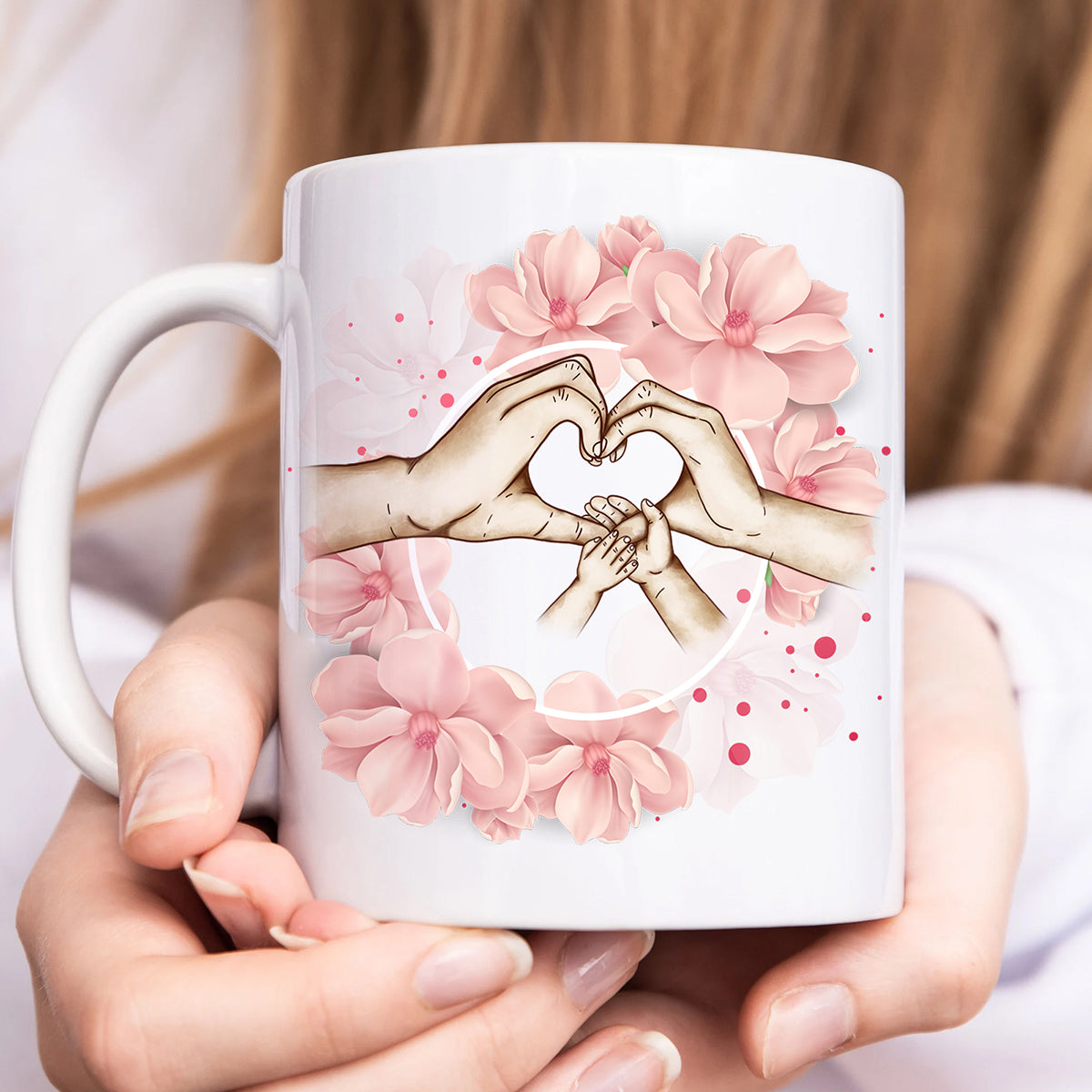 Personalized family mug featuring hands making a heart shape with pink floral accents